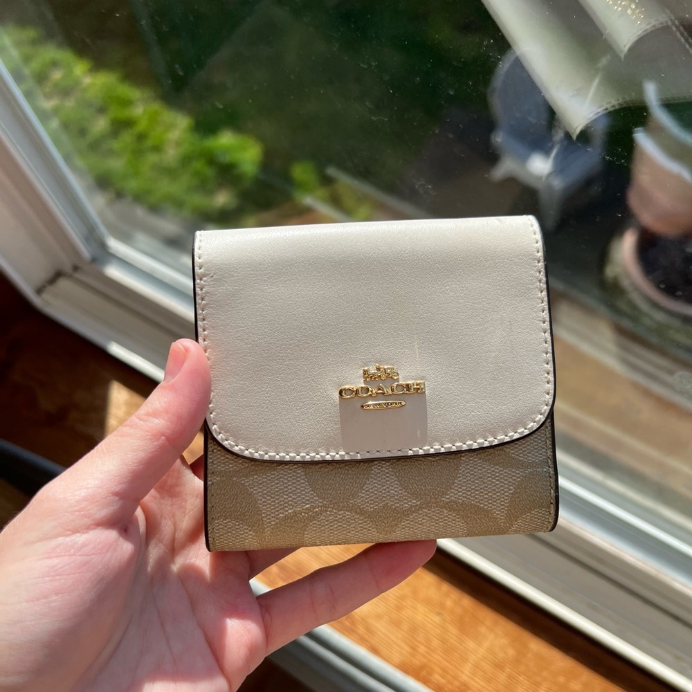 Coach small trifold wallet in blocked signature canvas